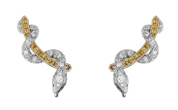 Signature Serpent 耳钉，by Garrard  镶嵌74颗圆形切割钻石，总重1.10ct，镶嵌24颗黄色蓝宝石，总重1.14ct，蛇眼为圆形切割蓝宝石，总重0.03ct
